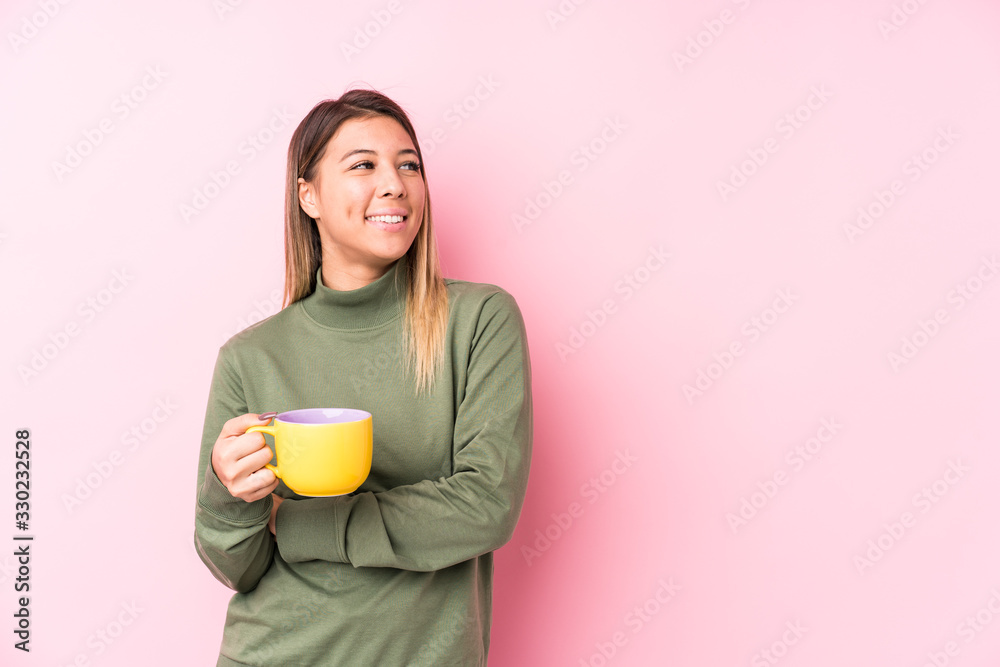 Young caucasian woman holding a coffee smiling confident with crossed arms. Young caucasian woman holding a coffee smiling confident with crossed arms.