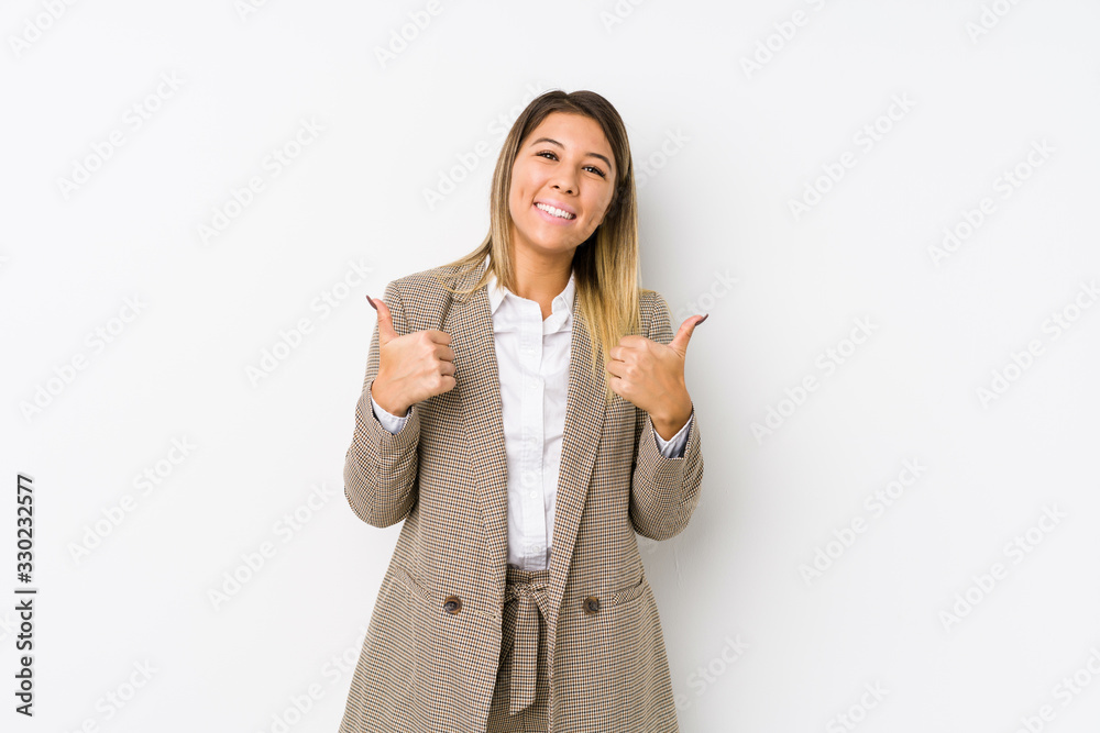 Young caucasian business woman isolated raising both thumbs up, smiling and confident. Young caucasian business woman isolated raising both thumbs up, smiling and confident.