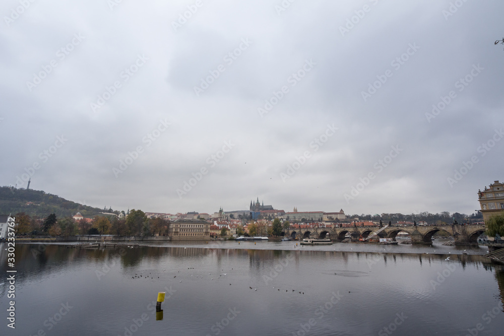 Panorama of the Old Town of Prague, Czech Republic, with a focus on Charles bridge (Karluv Most)  and the Prague Castle (Prazsky hrad) seen from Vltava river. 