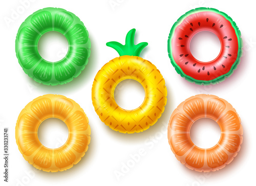 Summer swim rings fruit set vector design. Inflatable rubber toy and swimming circles with different textures and shapes isolated in white background. Vector illustration