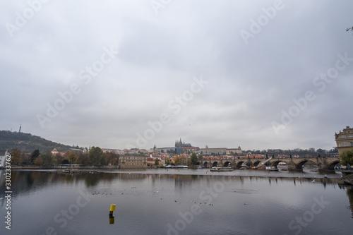 Panorama of the Old Town of Prague, Czech Republic, with a focus on Charles bridge (Karluv Most) and the Prague Castle (Prazsky hrad) seen from Vltava river. 