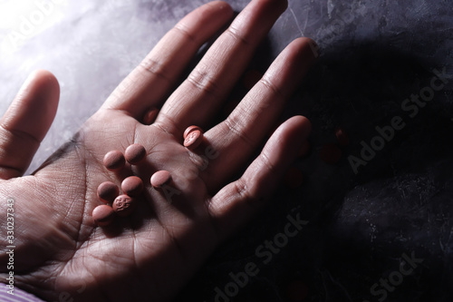 Drug and cooked heroin on man hand 