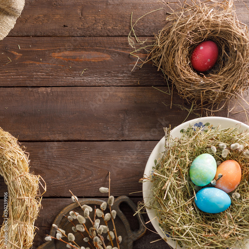 Wallpaper Mural Still life of easter eggs in a bird's nest on a wooden background. Rustic. Decoration of natural. Easter celebration concept. Copy space. Flat lay. Square. Torontodigital.ca