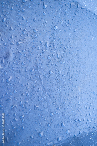 Water drops with blue texture background
