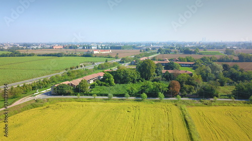 Aerial view of countryside: Green fields and town in summer © Wheat field