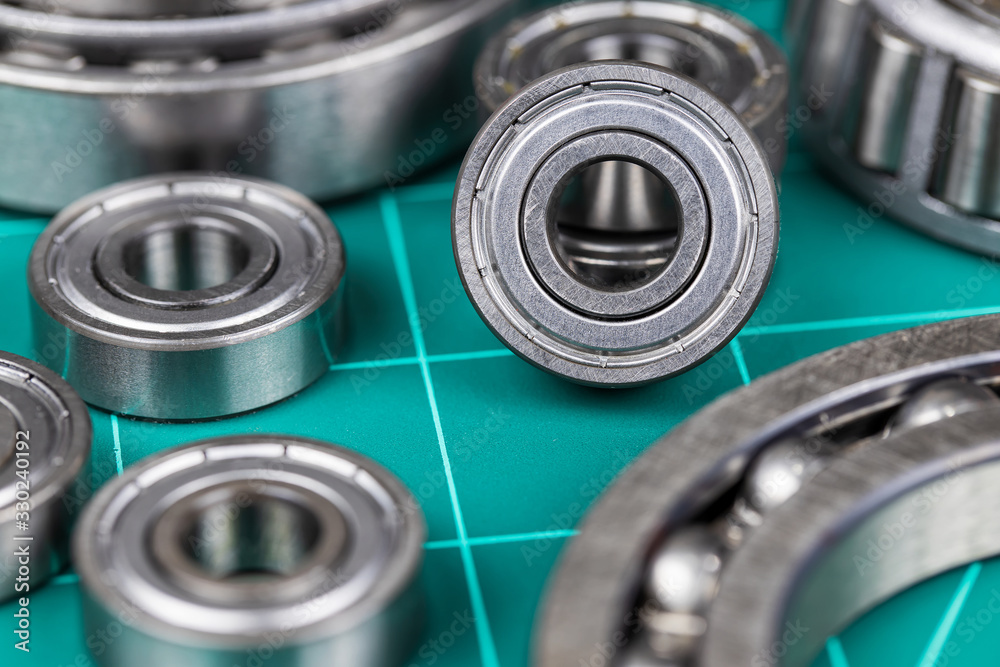 Closeup of steel ball bearings on cutting mate.. Closeup of steel ball bearings on cutting mate..