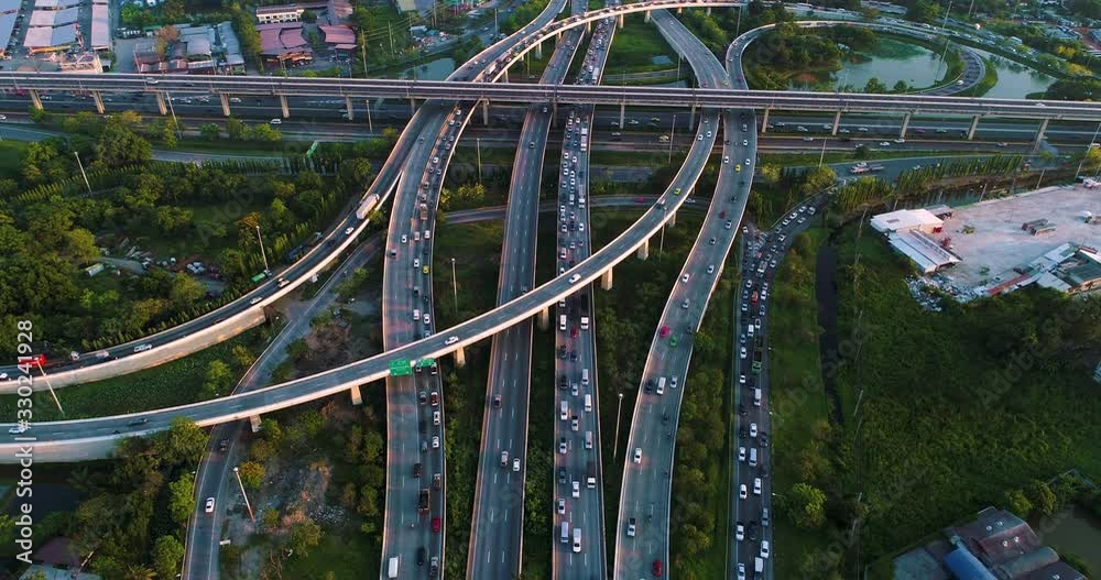 Aerial view city transport junction croos road with car movement day time Aerial view city transport junction croos road with car movement day time