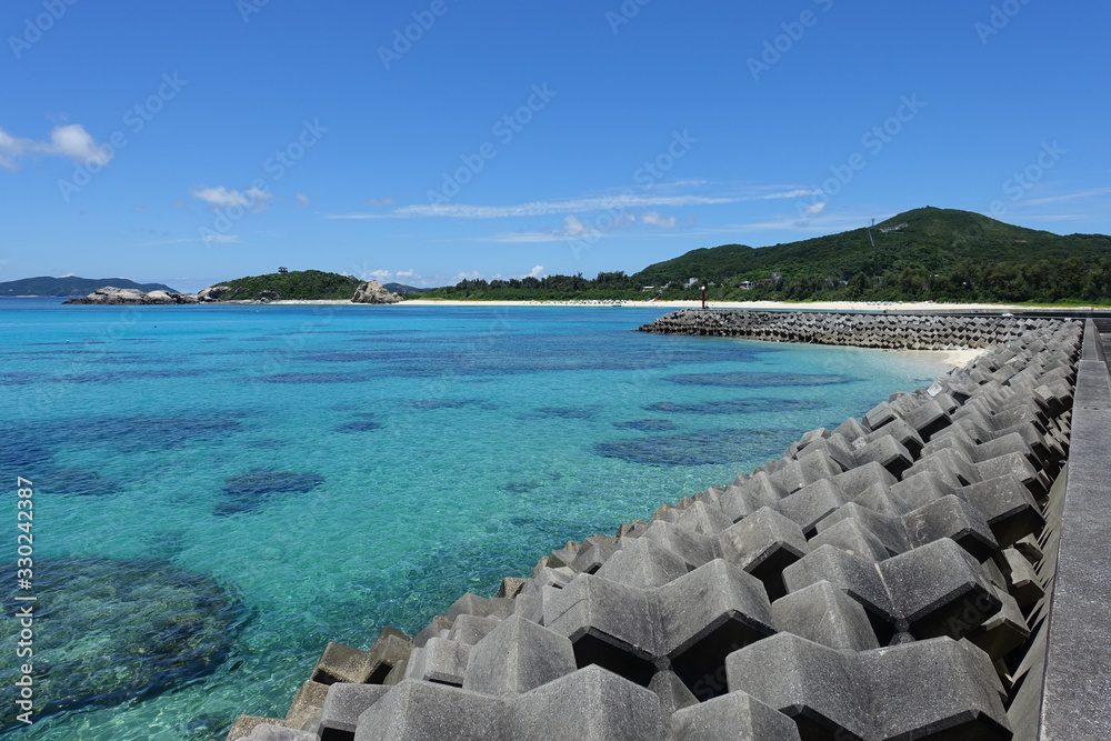 Fototapeta premium Okinawa Japan - Tokashiki Island Aharen protective wall marina
