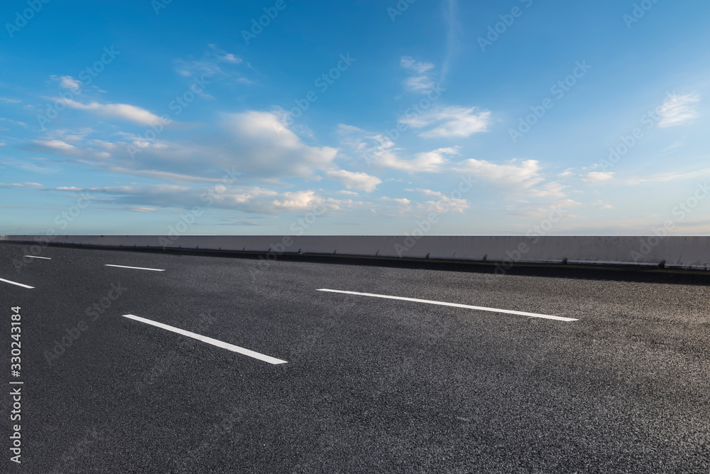 Skyline of Asphalt Pavement and Blue Sky and White Cloud Skyline of Asphalt Pavement and Blue Sky and White Cloud