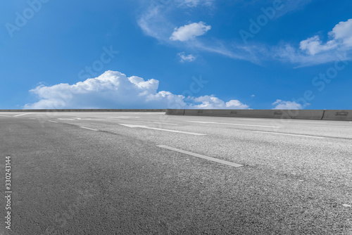 Asphalt Highway Skyline and Blue Sky and White Cloud photo