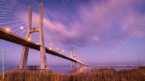 Vasco de Gama bridge at sunrise with sunrise