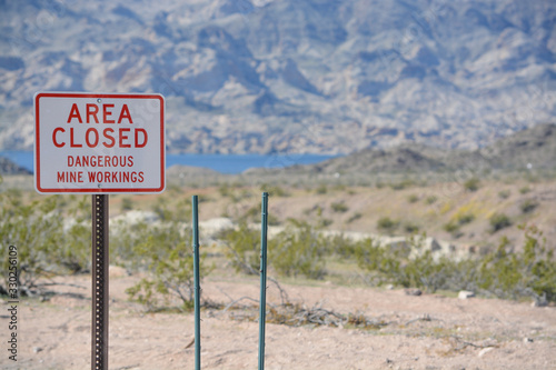 Area Closed Dangerous Mine Workings Sign Abandoned mines in the Lake Mead National Recreation Area. Mohave County, Arizona USA