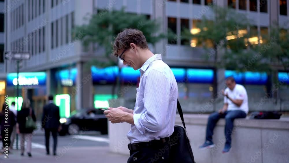 Slow motion effect of successful male trader standing at urbanity and using mobile app for checking account balance happy with result on touchscreen, Caucasian businessman reading web news Slow motion effect of successful male trader standing at urbanity and using mobile app for checking account balance happy with result on touchscreen, Caucasian businessman reading web news