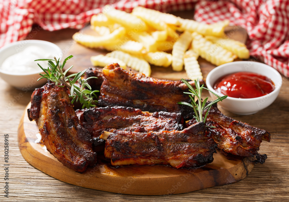 Grilled pork ribs with rosemary and french fries