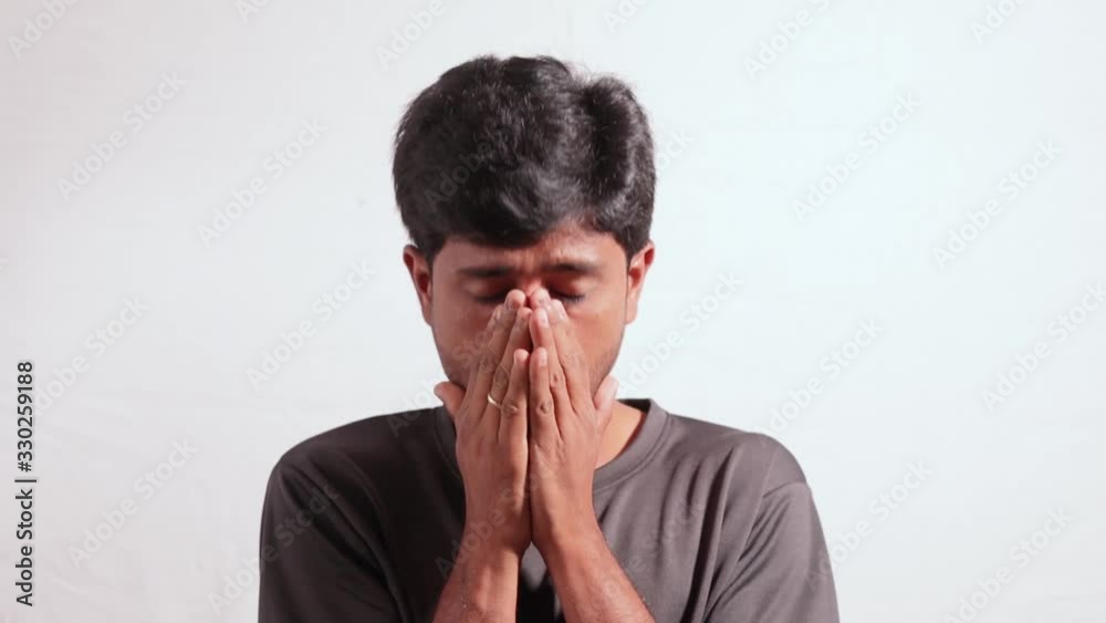 Young man Sneezing or coughing by covering ram elbow and hands isolated background - concept to protect from spreading coronavirus or covid 19 outbreak while sneezing Young man Sneezing or coughing by covering ram elbow and hands isolated background - concept to protect from spreading coronavirus or covid 19 outbreak while sneezing