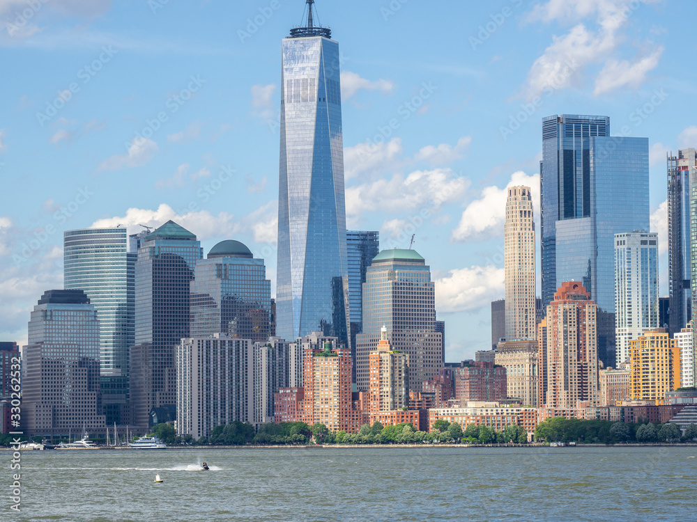 Obraz premium New York, NY, USA. Amazing skyline of Manhattan skyscrapers and buildings from Ellis Island. Landscape inclusive of the Freedom tower - One World Trade Center