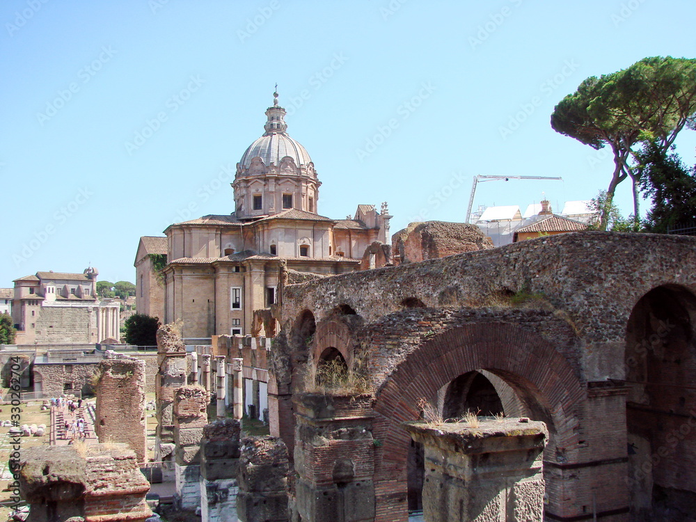 Panorama of the millennium ruins of the eternal city, along with sophisticated architectural compositions of Catholic cathedrals.