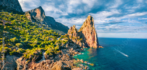 View from flying drone. Gorgeous summer view of historical landmark - Pedra Longa. Fantastic morning scene of Sardinia island, Italy, Europe. Exciting Mediterranean seascape. photo