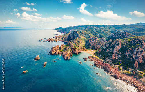 View from flying drone. Aerial morning view of Li Cossi beach. Wonderful summer scene of Costa Paradiso, Sardinia island, Italy, Europe. Attractive Mediterranean seascape.
