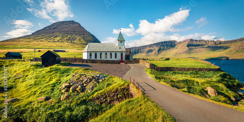 Fototapeta Bright morning view of Vidareidi Kirkja