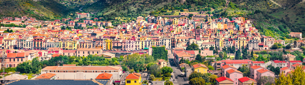 Panoramic morning cityscape of Bosa town, Province of Oristano, Italy, Europe. Sunny summer scene of Sardinia. Architecture traveling background.