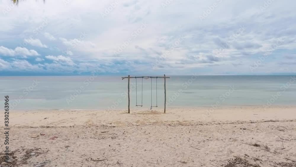 Wooden swing on the seafront on Sula Island, North Maluku, Indonesia. Wooden swing on the seafront on Sula Island, North Maluku, Indonesia.