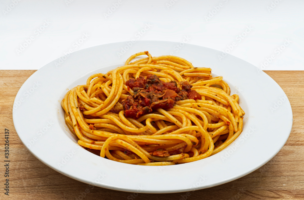 Italian seafood pasta with clams. Spaghetti alle Vongole on wooden table Italian seafood pasta with clams. Spaghetti alle Vongole on wooden table