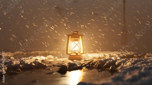 Old vintage hand lantern warming a frozen surrounding during a winter blizzard. photo