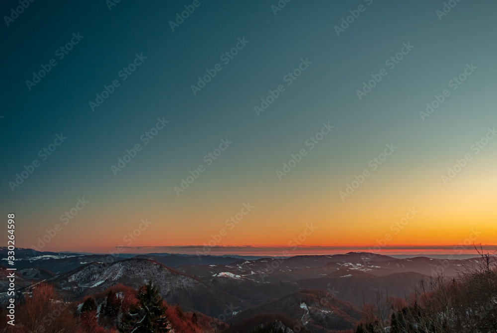 Fototapeta premium Winter sunset in the hills of Slovenia