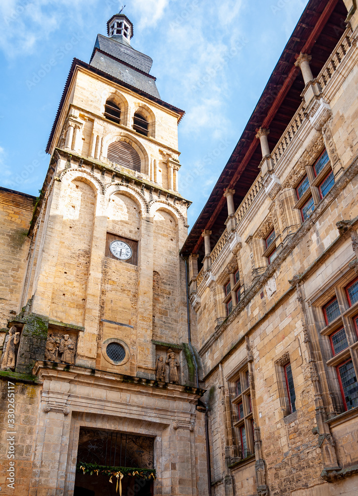 Sarlat in Aquitaine, France. The capital of Périgord Noir, a medieval village full of picturesque alleys and monuments. View of the bell tower of the Gothic Romanesque Cathedral of 