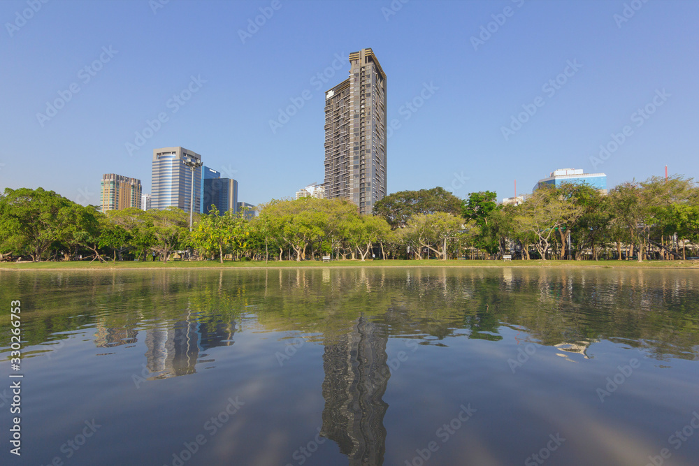View in the city park surrounded by tall buildings