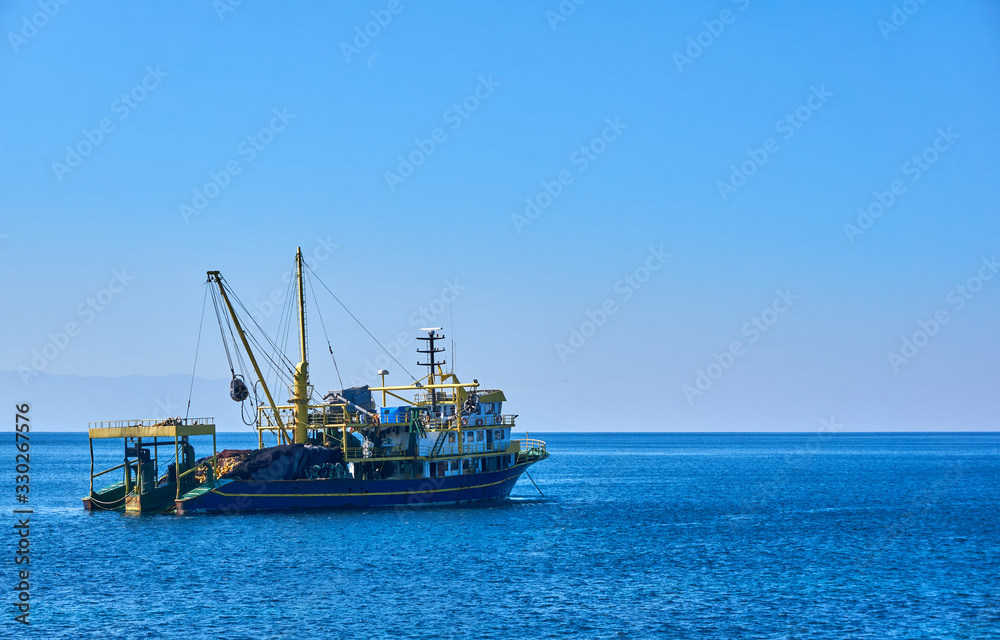 Trawl fishing boat near plan shot