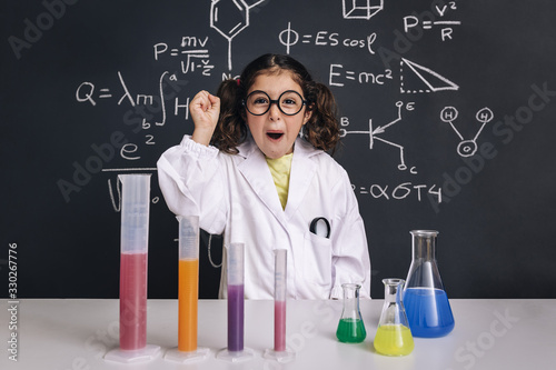 happy scientist child celebrating an idea