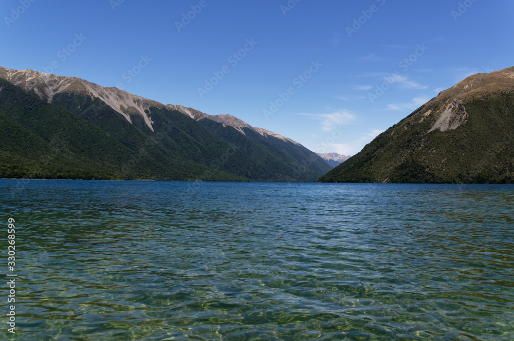 Looking up Lake Rotoiti as the lake disappears between the mountains Looking up Lake Rotoiti as the lake disappears between the mountains