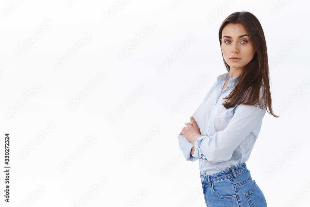 Confident stylish professional woman running own business looking assertive and ready, standing in profile turn face to came with sassy determined expression, cross hands chest self-assured Confident stylish professional woman running own business looking assertive and ready, standing in profile turn face to came with sassy determined expression, cross hands chest self-assured