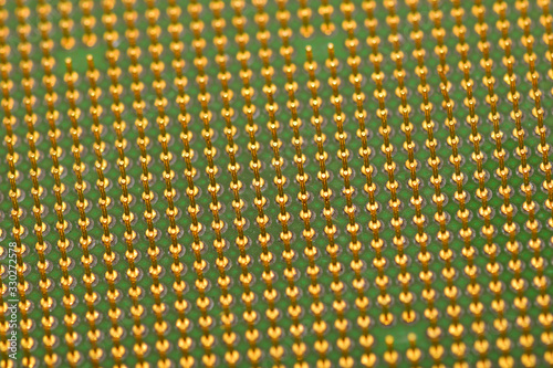 Golden pins of a core. Central processor unit. Shallow depth of field.