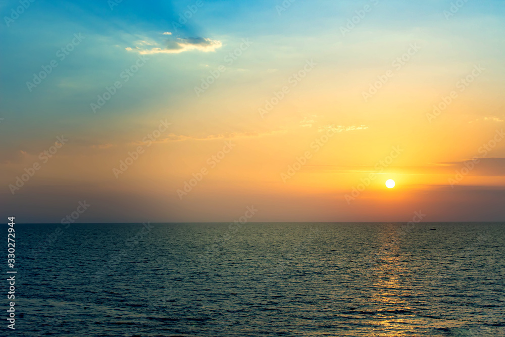 Beautiful summer sunset on the sea. Delicate sunset colors.