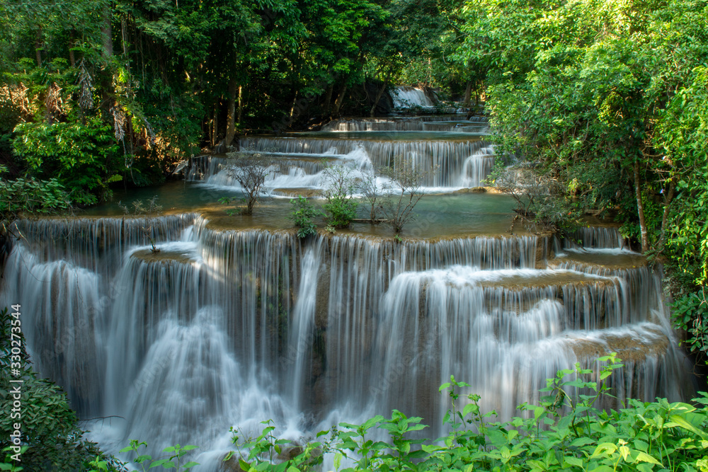 Huay Mae Khamin waterfalls in deep forest at Srinakarin National Park ,Kanchanaburi ,A beautiful stream water famous rainforest waterfall in Thailand