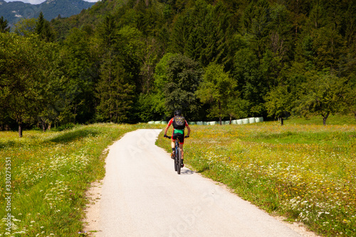 Fototapeta Naklejka Na Ścianę i Meble -  Mountain Bike cyclist riding countryside track