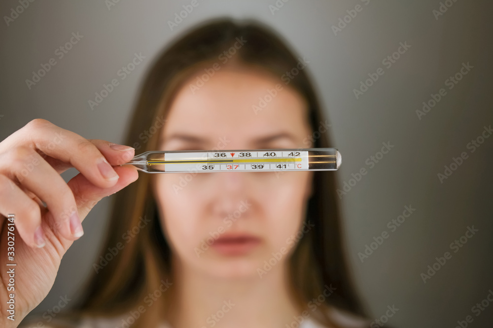 Doctor holding thermometer in temperature Doctor holding thermometer in temperature