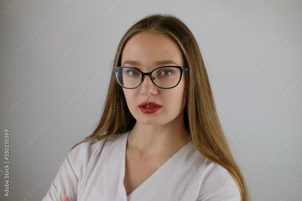 Girl with glasses and a white coat