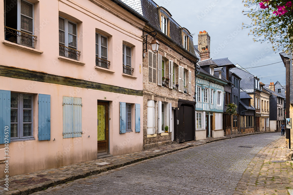 Honfleur, France. Colorful old buildings on Bavole street