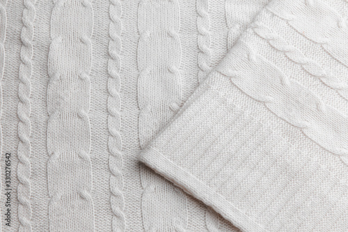 Dairy wool knitted fabric with texture. Handwork.