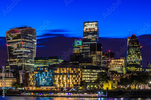 Illuminated London cityscape in financial district at night