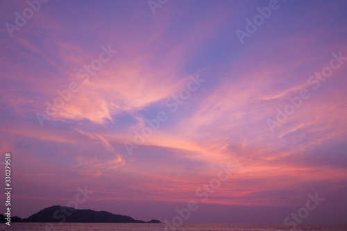 Stunning purple sunset on a tropical beach. © evelinphoto