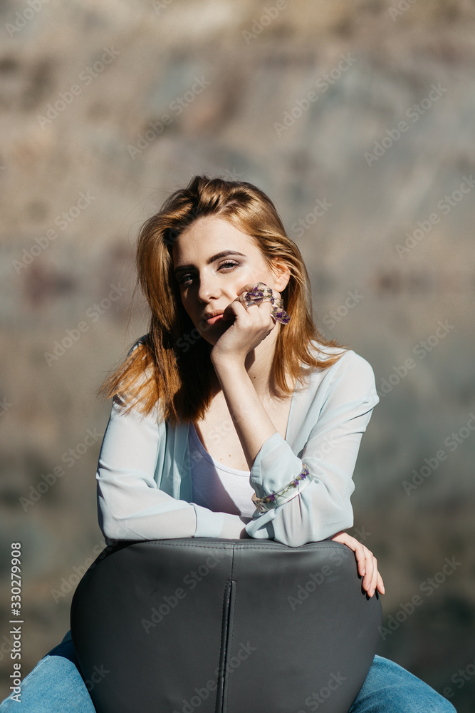 Romantic portrait of beautiful model wearing handmade jewellery, rings, necklace, bracelet. Outdoors portrait on sunny day. Romantic portrait of beautiful model wearing handmade jewellery, rings, necklace, bracelet. Outdoors portrait on sunny day.