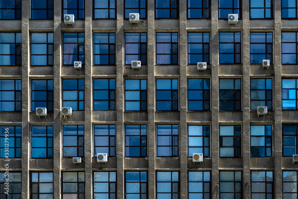 The reflection of the building in the windows of a new home