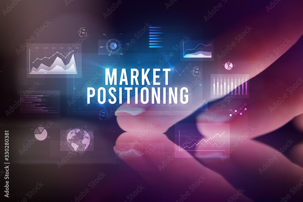 Finger touching tablet with charts and MARKET POSITIONING inscription, business concept Finger touching tablet with charts and MARKET POSITIONING inscription, business concept