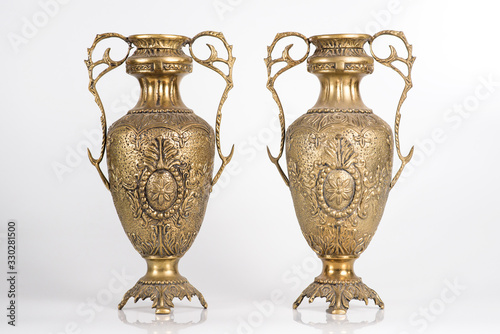 bronze vases on a white background, ancient jugs of bronze, bronze antique vases front view, vintage vessels studio photo, bronze amphorae isolated