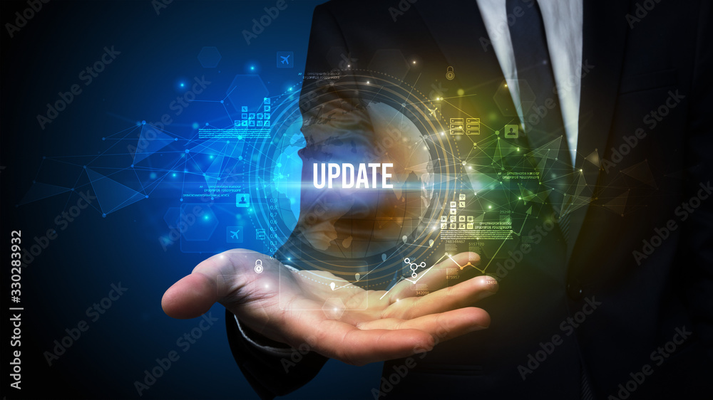 Obraz premium Elegant hand holding UPDATE inscription, digital technology concept